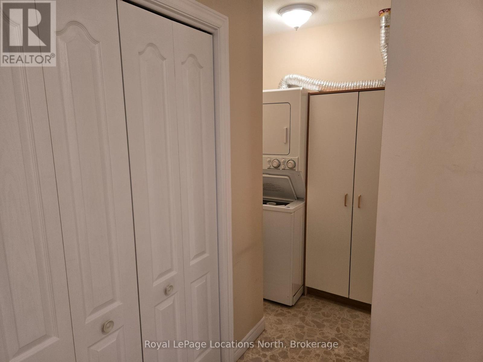 Laundry room with stackable washer/dryer - Unit # 23 - 275 Huron Street, Clearview (Stayner), ON - Indoor Photo Showing Other Room