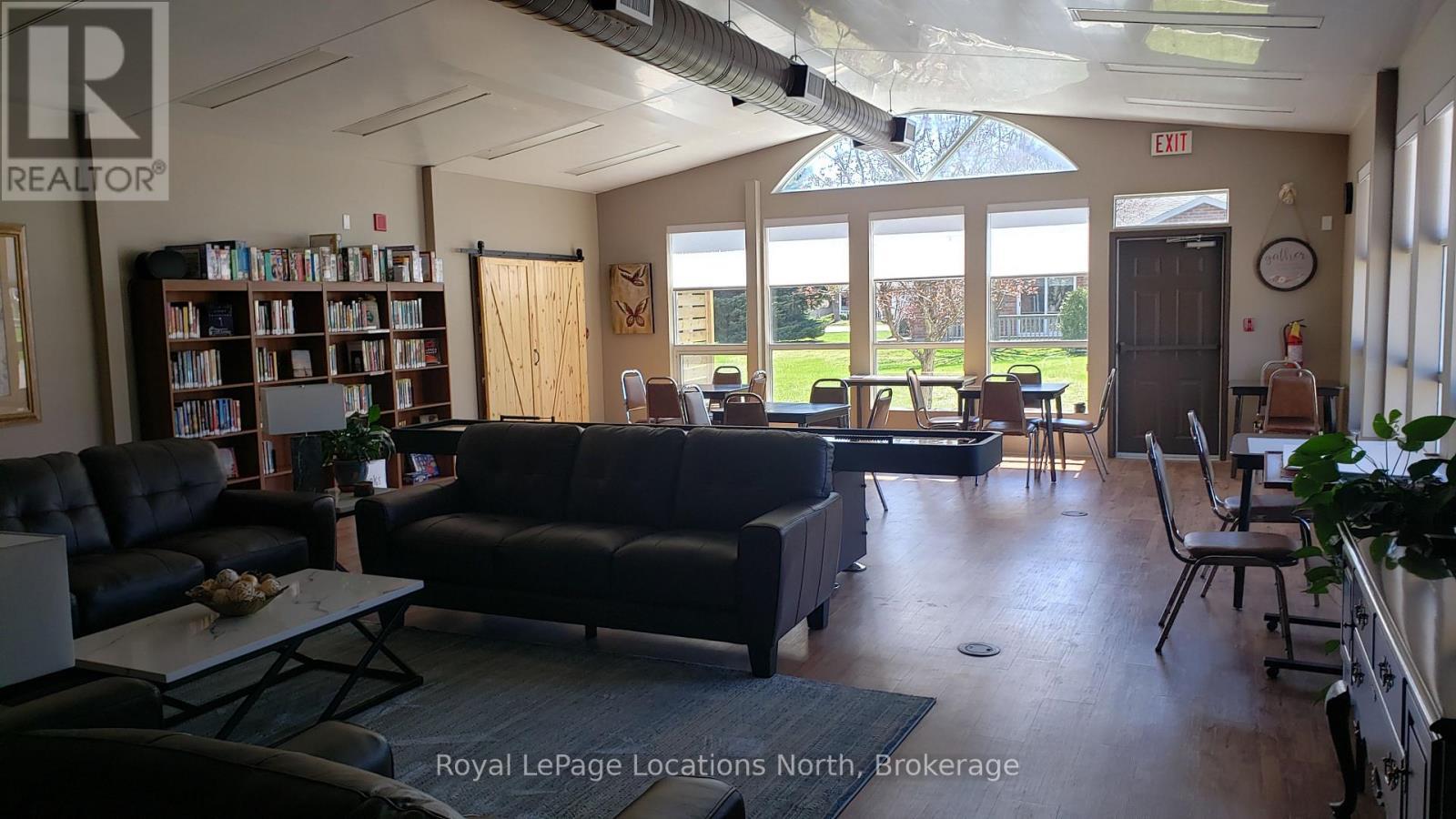 Small library - Unit # 23 - 275 Huron Street, Clearview (Stayner), ON - Indoor Photo Showing Living Room