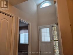 Bright front entrance with vaulted ceiling -