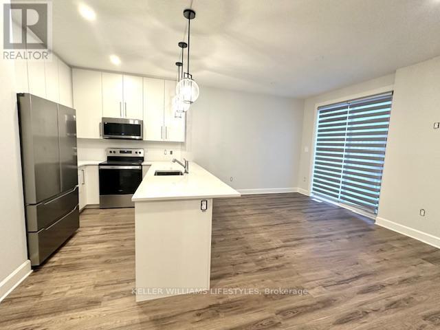 233 - 175 Doan Drive, Middlesex Centre, ON - Indoor Photo Showing Kitchen