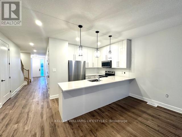 233 - 175 Doan Drive, Middlesex Centre, ON - Indoor Photo Showing Kitchen