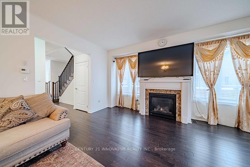 3 Whitefish Street, Whitby, ON - Indoor Photo Showing Living Room With Fireplace