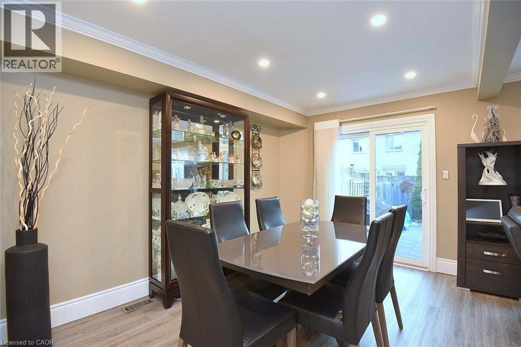 Dining area featuring light wood-style flooring, crown molding, and recessed lighting - 1245 Stephenson Drive Unit# 20, Burlington, ON