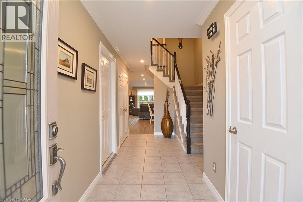 Entryway with light tile patterned floors, stairs, crown molding, and recessed lighting - 1245 Stephenson Drive Unit# 20, Burlington, ON