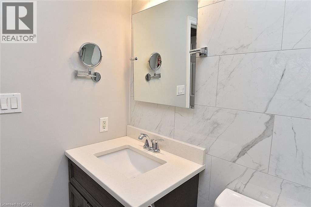 Bathroom featuring vanity and toilet - 1245 Stephenson Drive Unit# 20, Burlington, ON