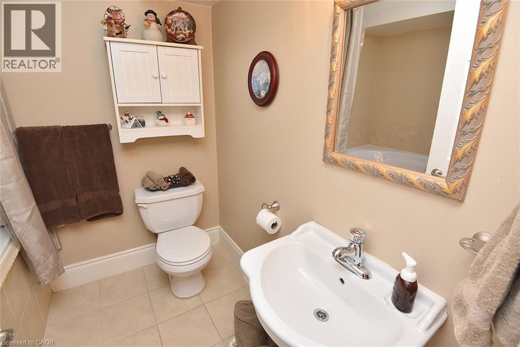 Full bathroom with a sink and tile patterned flooring - 1245 Stephenson Drive Unit# 20, Burlington, ON