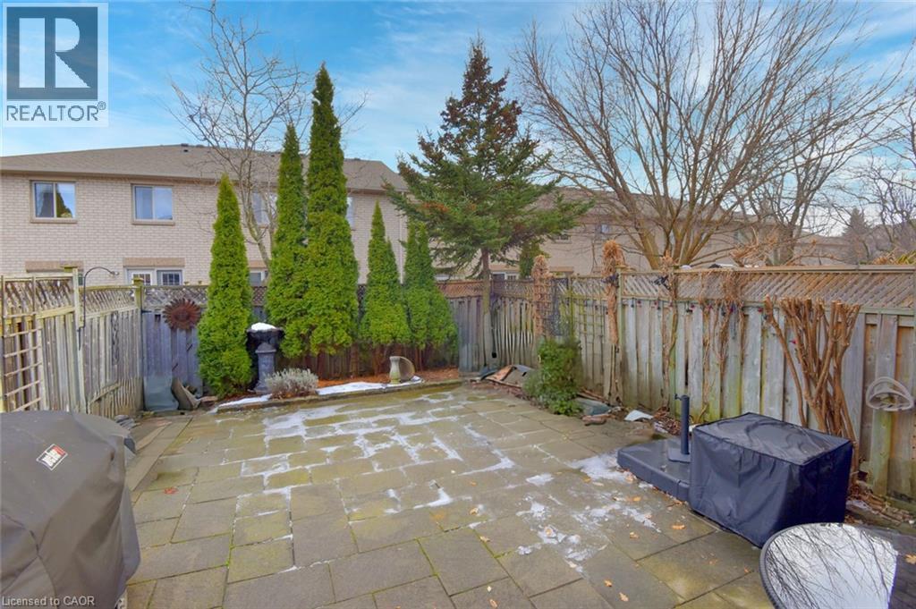 Fenced backyard featuring a grill and a patio - 1245 Stephenson Drive Unit# 20, Burlington, ON