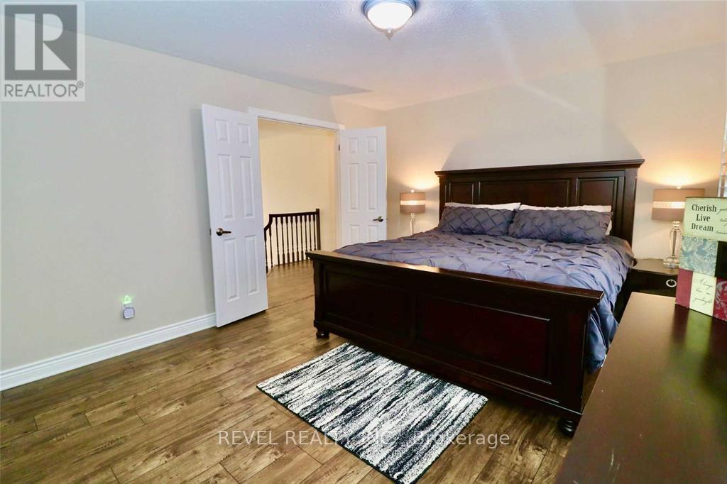 Primary Bedroom - 412 Olde Village Lane, Shelburne, ON - Indoor Photo Showing Bedroom