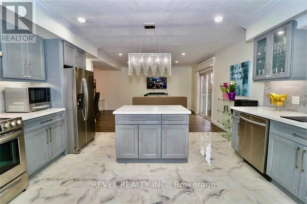 Updated Kitchen w/ floating island - 412 Olde Village Lane, Shelburne, ON - Indoor Photo Showing Kitchen