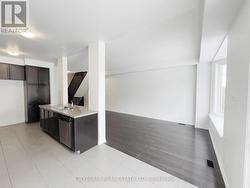 Kitchen & Family Room Viewed from Breakfast Area -