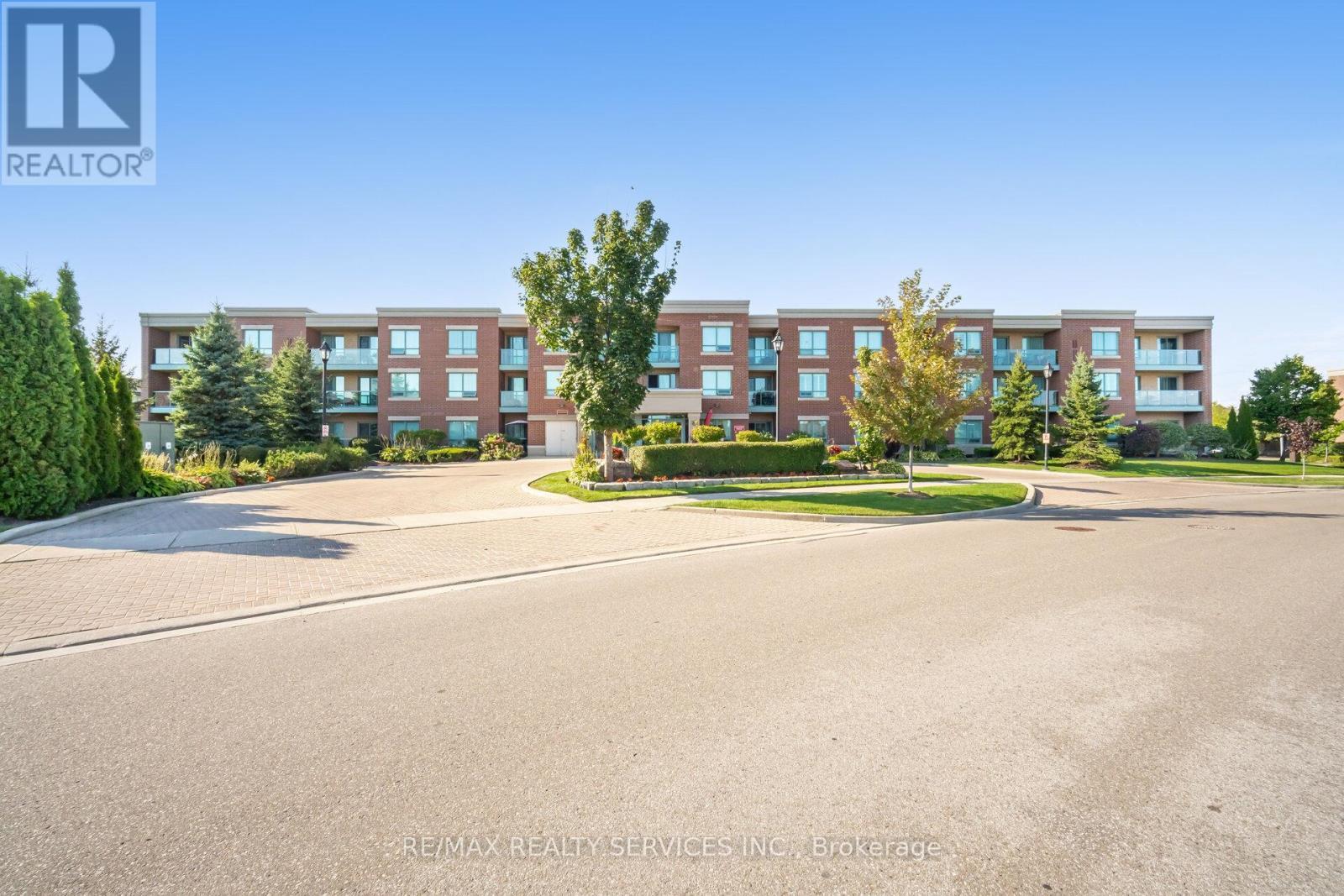 105 - 60 Via Rosedale Way, Brampton, ON - Outdoor With Balcony With Facade