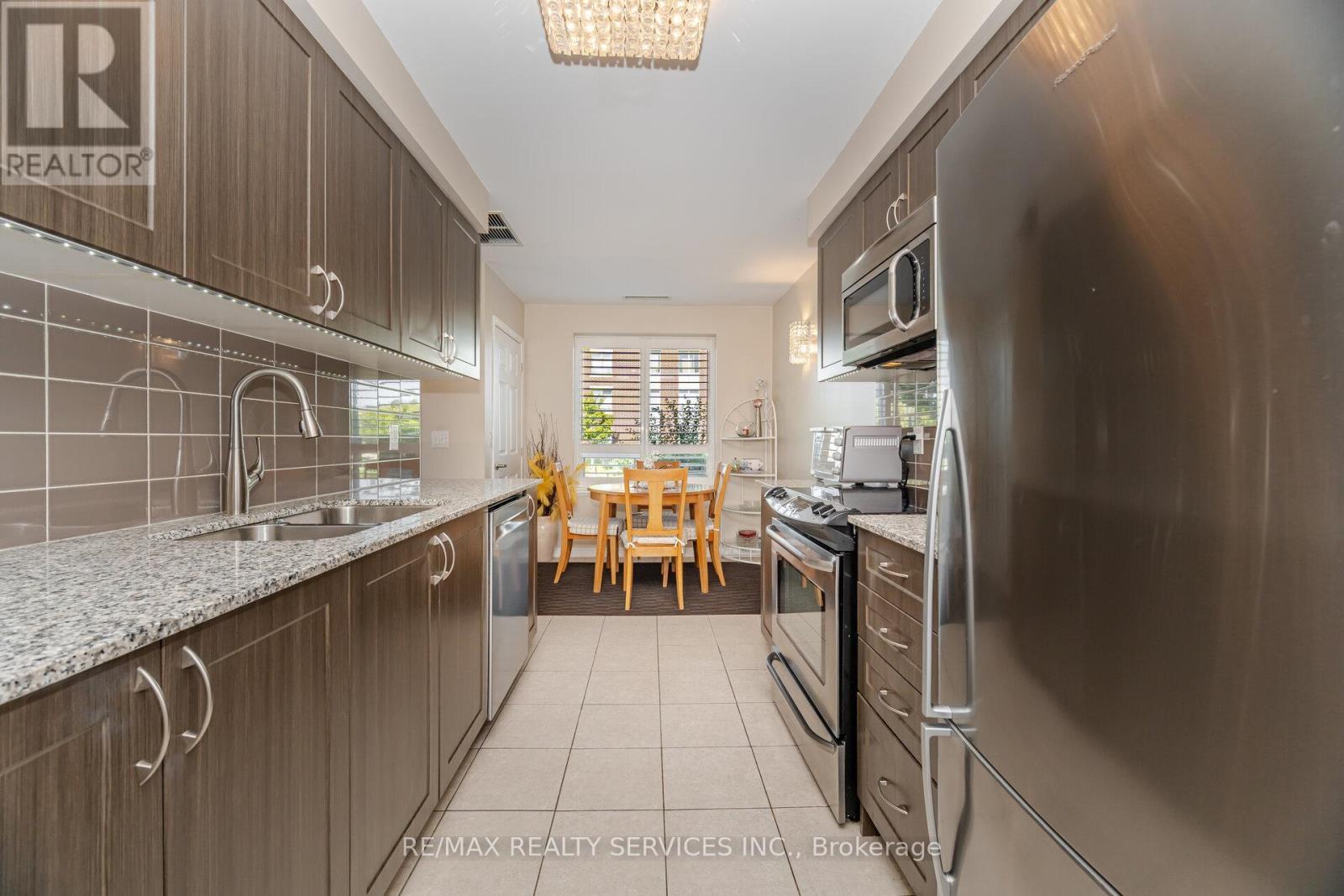 105 - 60 Via Rosedale Way, Brampton, ON - Indoor Photo Showing Kitchen With Stainless Steel Kitchen With Double Sink With Upgraded Kitchen