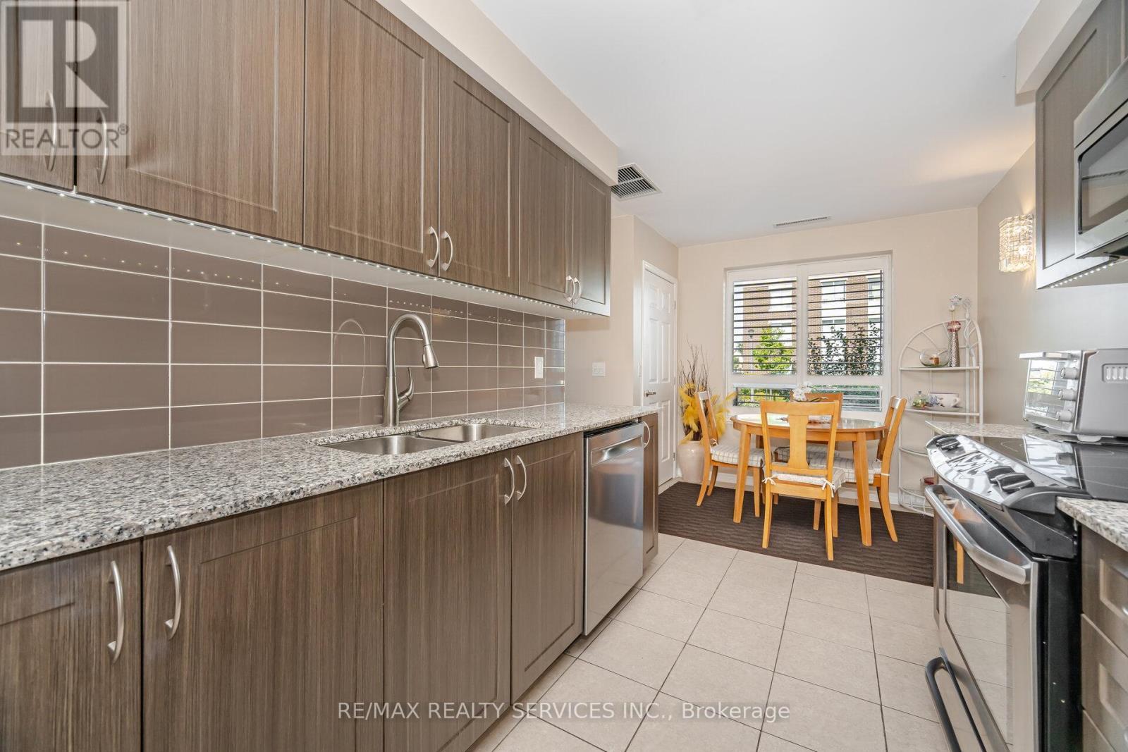 105 - 60 Via Rosedale Way, Brampton, ON - Indoor Photo Showing Kitchen With Double Sink