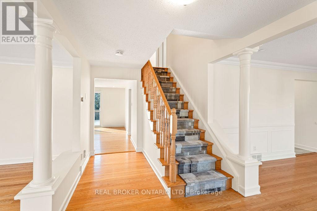 Oak Hardwood & Staircase with Carpet Runner - 99 Queensline Drive, Ottawa, ON - Indoor Photo Showing Other Room