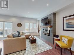 Living room, with electric fireplace & Large condo -