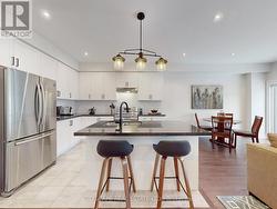 Kitchen, with Granite counters & centre island. -