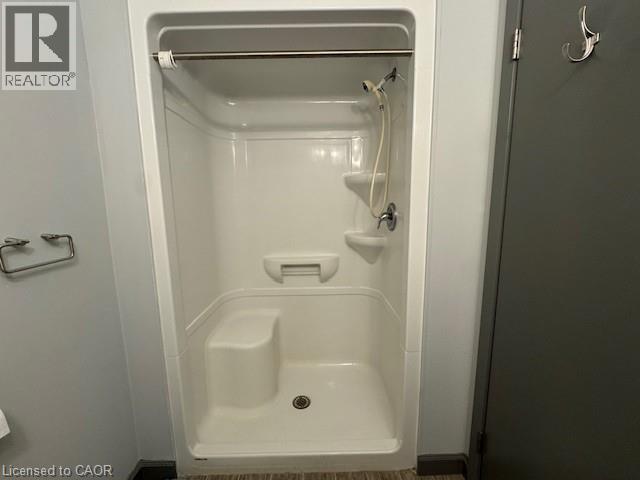 Bathroom featuring a shower stall - 77 Leland Street Unit# 223, Hamilton, ON - Indoor Photo Showing Bathroom