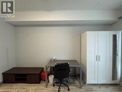 Office with wood finished floors -