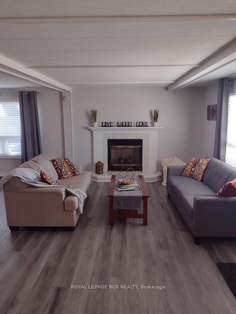 4 Linden Lane, Innisfil, ON - Indoor Photo Showing Living Room With Fireplace