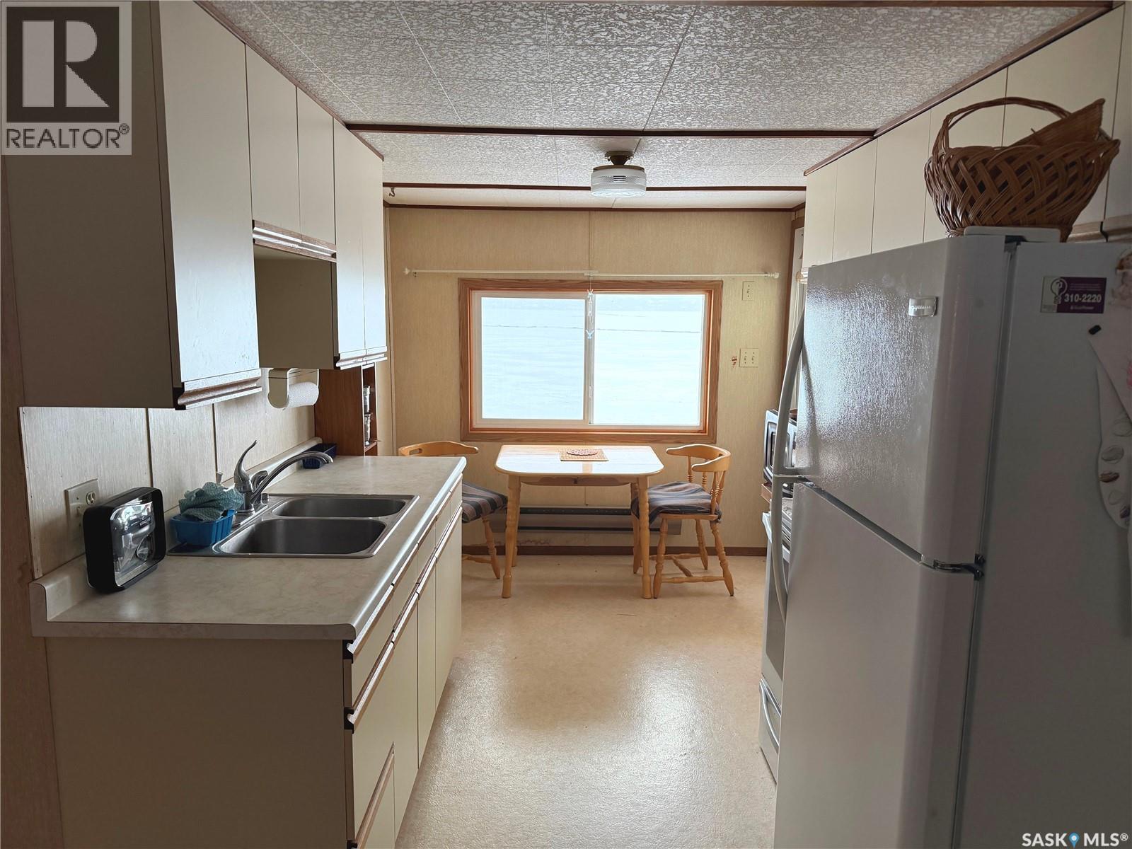 177 Katepwa Road, Katepwa Beach, SK - Indoor Photo Showing Kitchen With Double Sink
