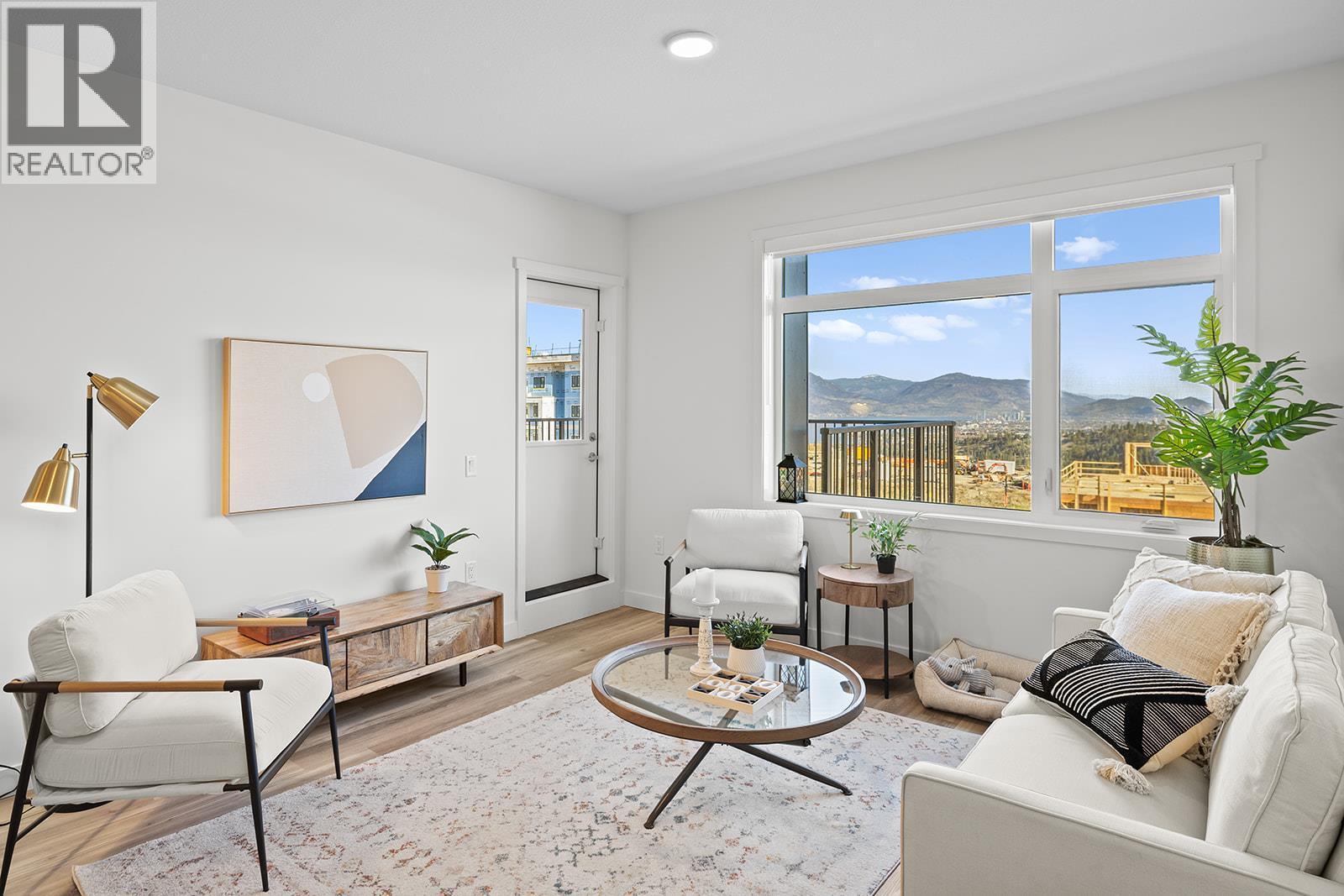 Photos are of a similar home; some features may vary - 1111 Frost Road Unit# 310, Kelowna, BC - Indoor Photo Showing Living Room