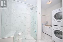 Modern spa-like shower with seating -