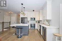 Bright kitchen with ss appliances & b/i microwave -