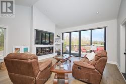 Living room with vaulted ceiling & natural light -