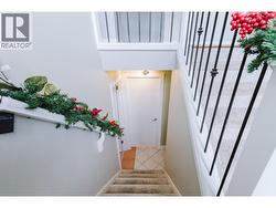 stairs to lower level bedroom, laundry and suite -