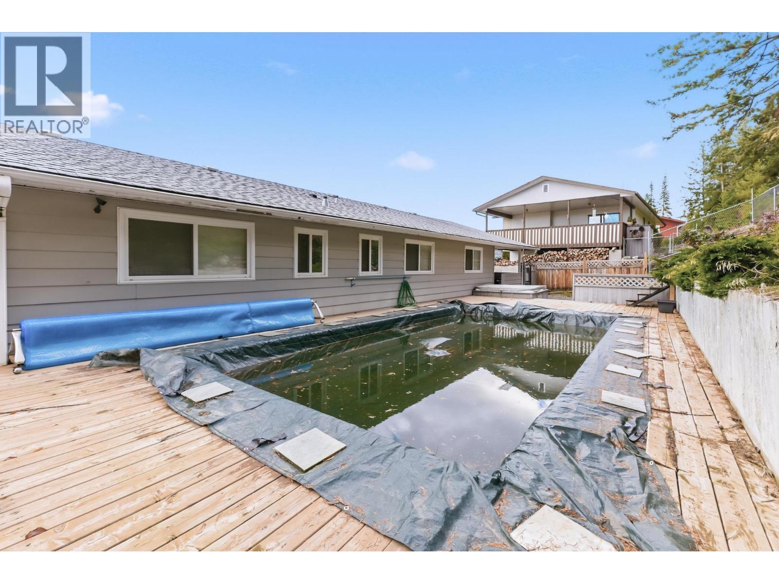 backyard with pool and hot tub - nature to the back - 2126 Verde Vista Road, Kelowna, BC - Outdoor With Deck Patio Veranda