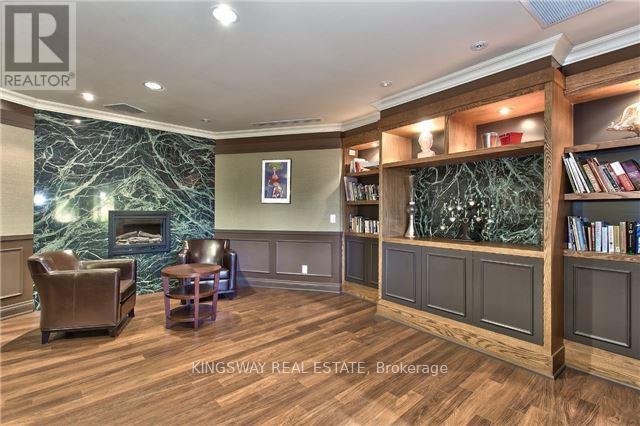 804 - 2391 Central Park Drive, Oakville, ON - Indoor Photo Showing Other Room With Fireplace