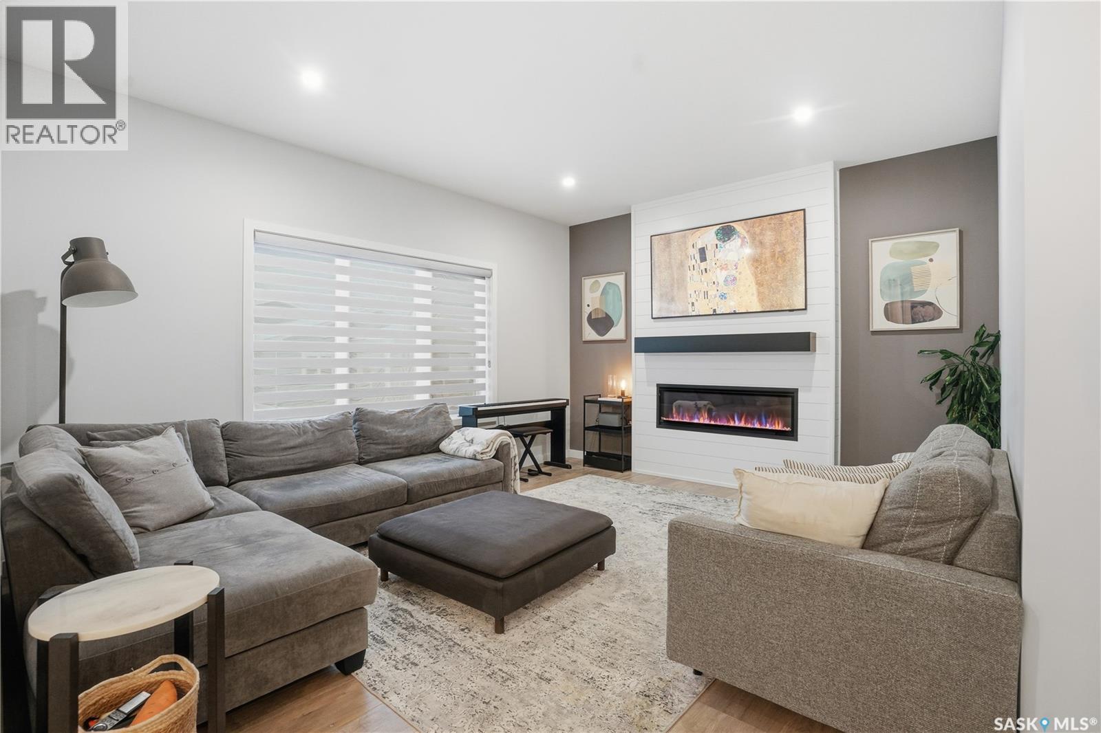 746 Bentley Manor, Saskatoon, SK - Indoor Photo Showing Living Room With Fireplace