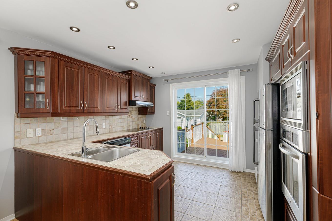 Kitchen - 3429 Rue De Toscane, Terrebonne (Terrebonne), QC - Indoor Photo Showing Kitchen With Double Sink