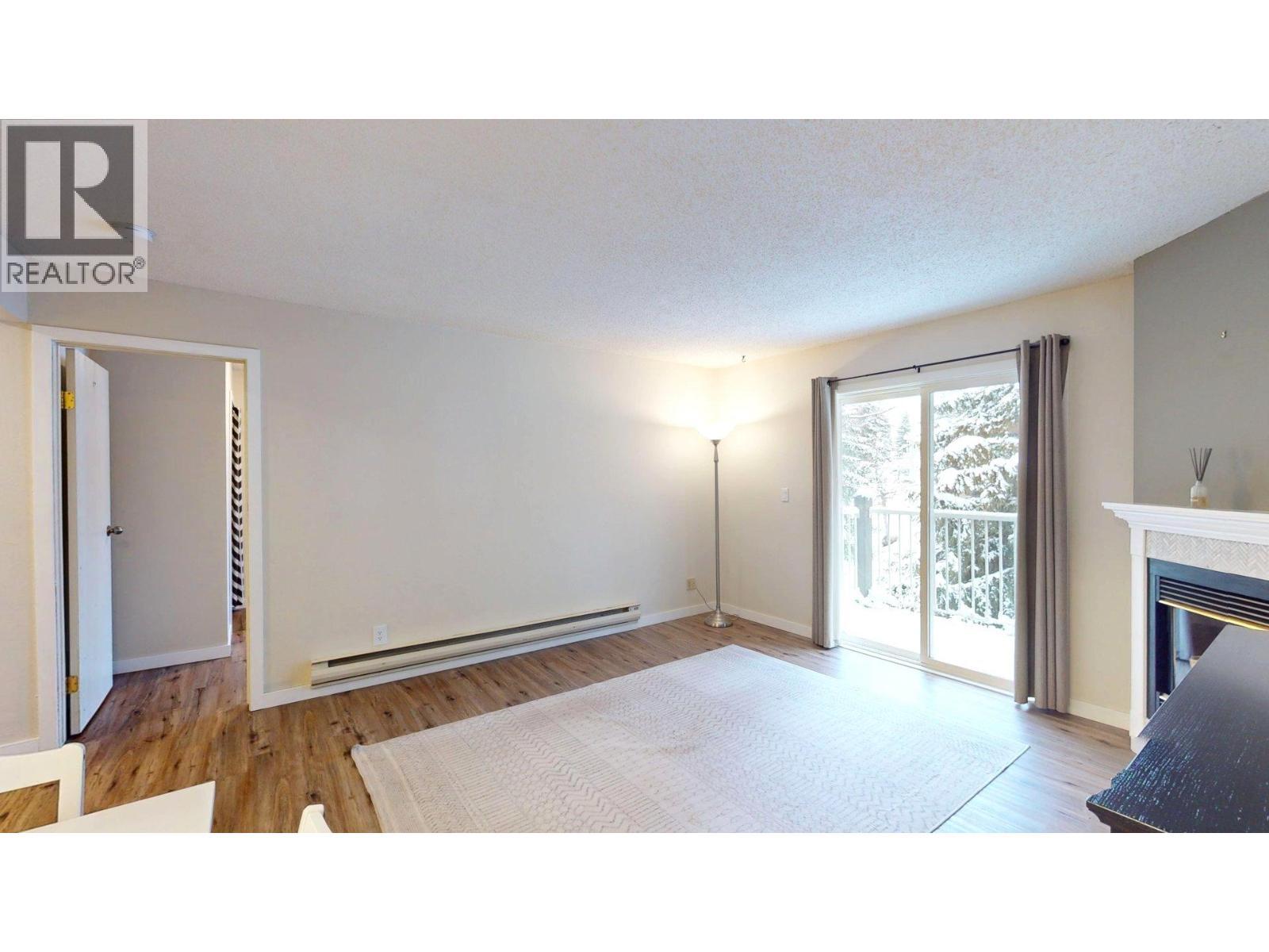 1802 Alpine Drive Unit# 302B, Elkford, BC - Indoor With Fireplace