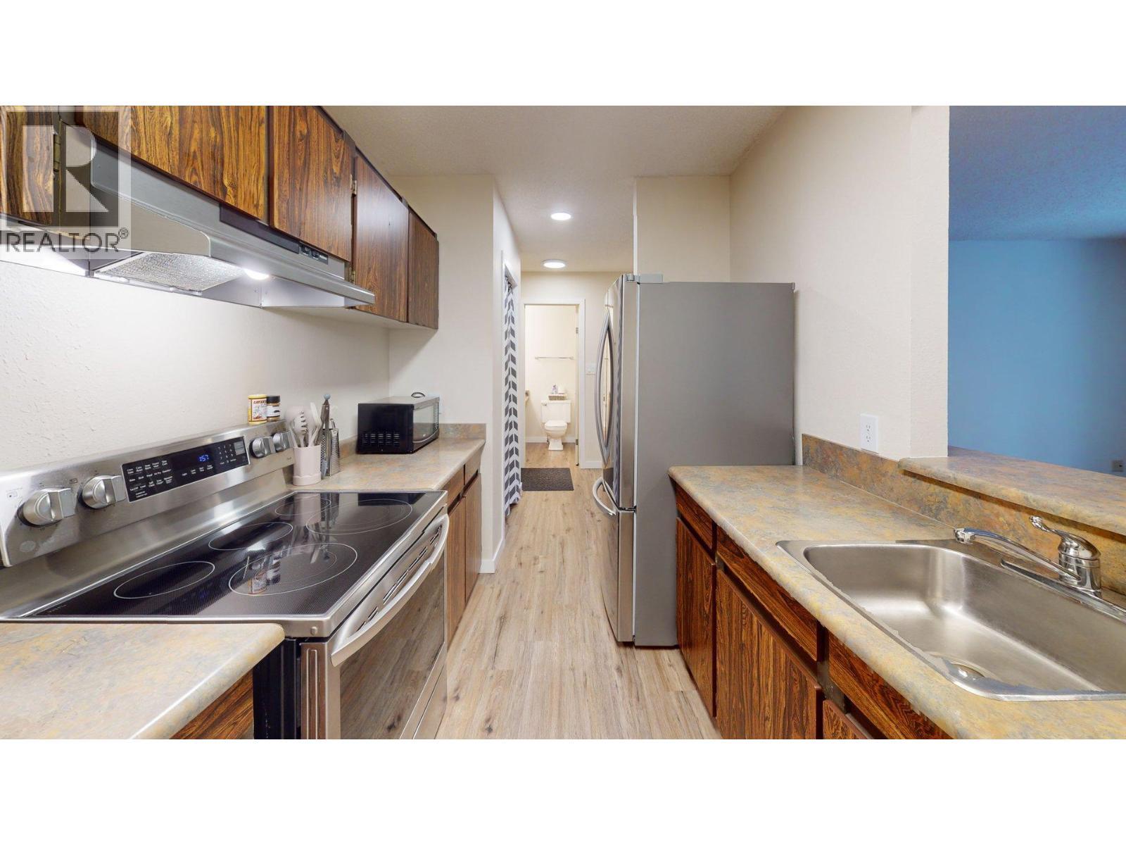 1802 Alpine Drive Unit# 302B, Elkford, BC - Indoor Photo Showing Kitchen With Stainless Steel Kitchen