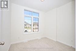 Primary bedroom with lots of natural light -