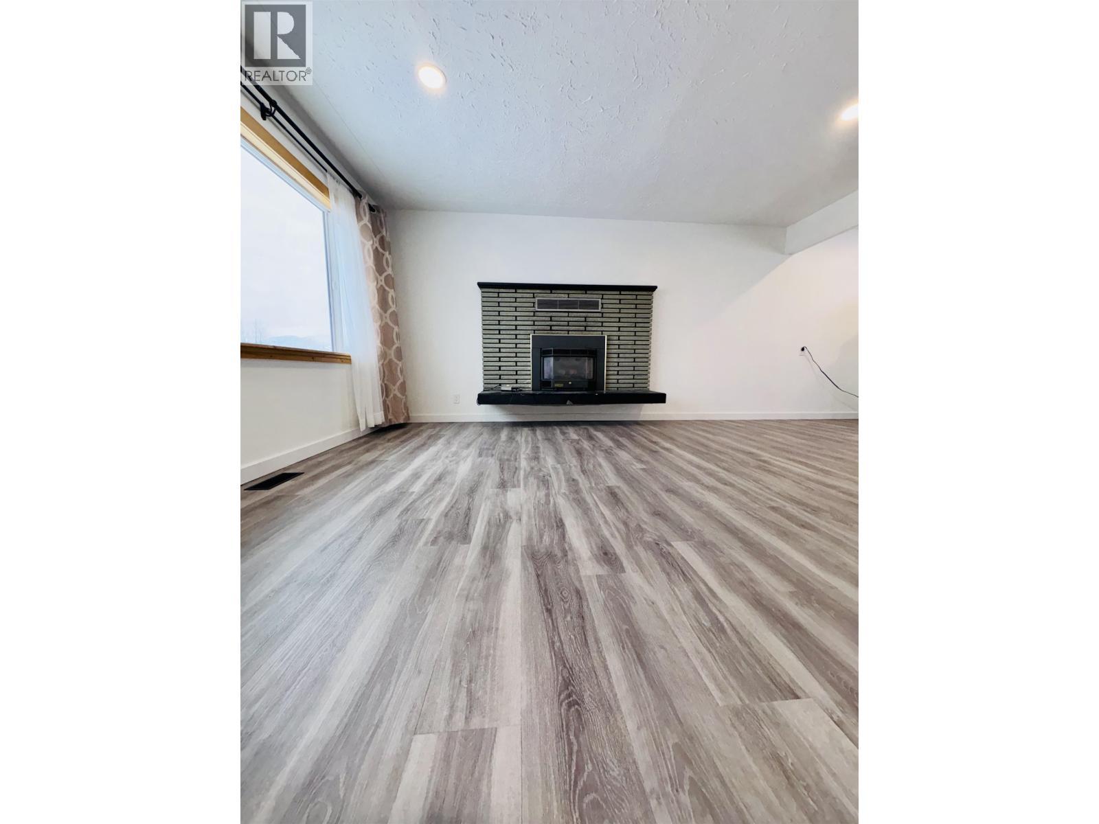 13 Wren Street, Kitimat, BC - Indoor Photo Showing Living Room With Fireplace