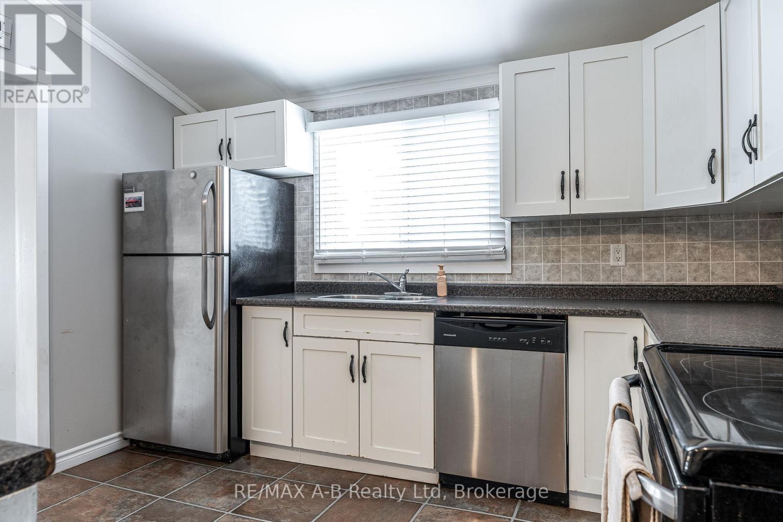 250 Orchard Avenue, Zorra, ON - Indoor Photo Showing Kitchen With Double Sink
