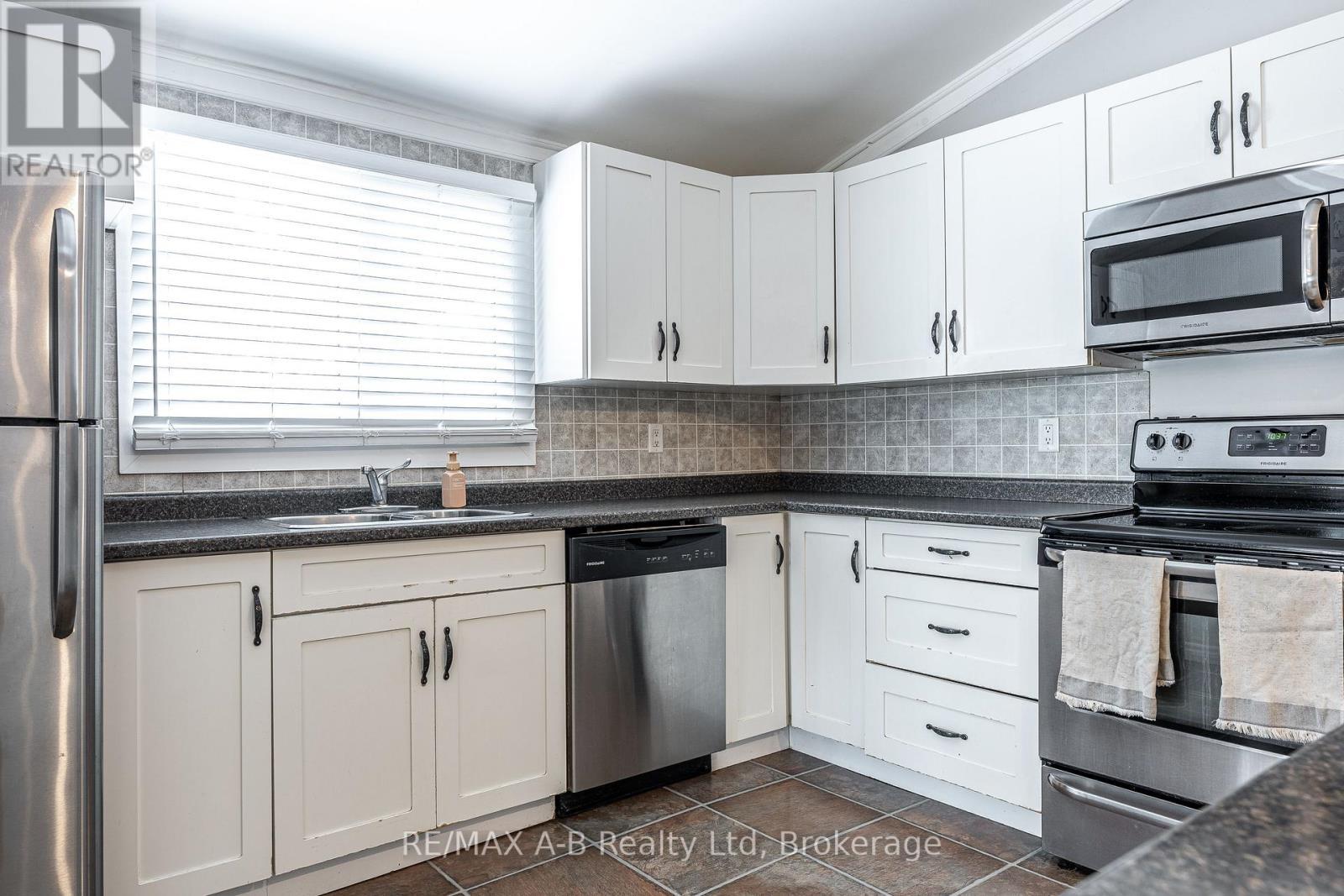 250 Orchard Avenue, Zorra, ON - Indoor Photo Showing Kitchen With Double Sink