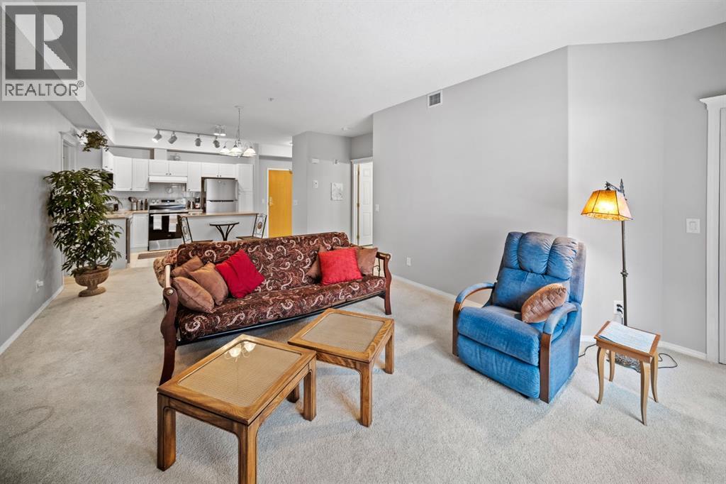 201, 223 Tuscany Springs Boulevard Nw, Calgary, AB - Indoor Photo Showing Living Room