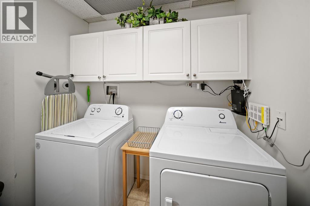 201, 223 Tuscany Springs Boulevard Nw, Calgary, AB - Indoor Photo Showing Laundry Room