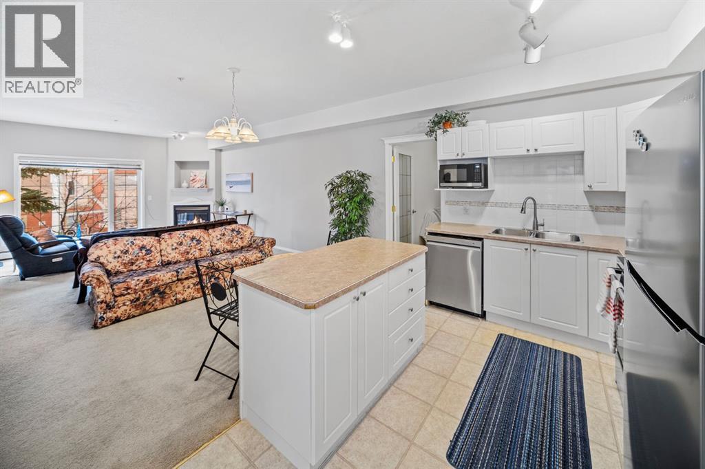201, 223 Tuscany Springs Boulevard Nw, Calgary, AB - Indoor Photo Showing Kitchen With Double Sink