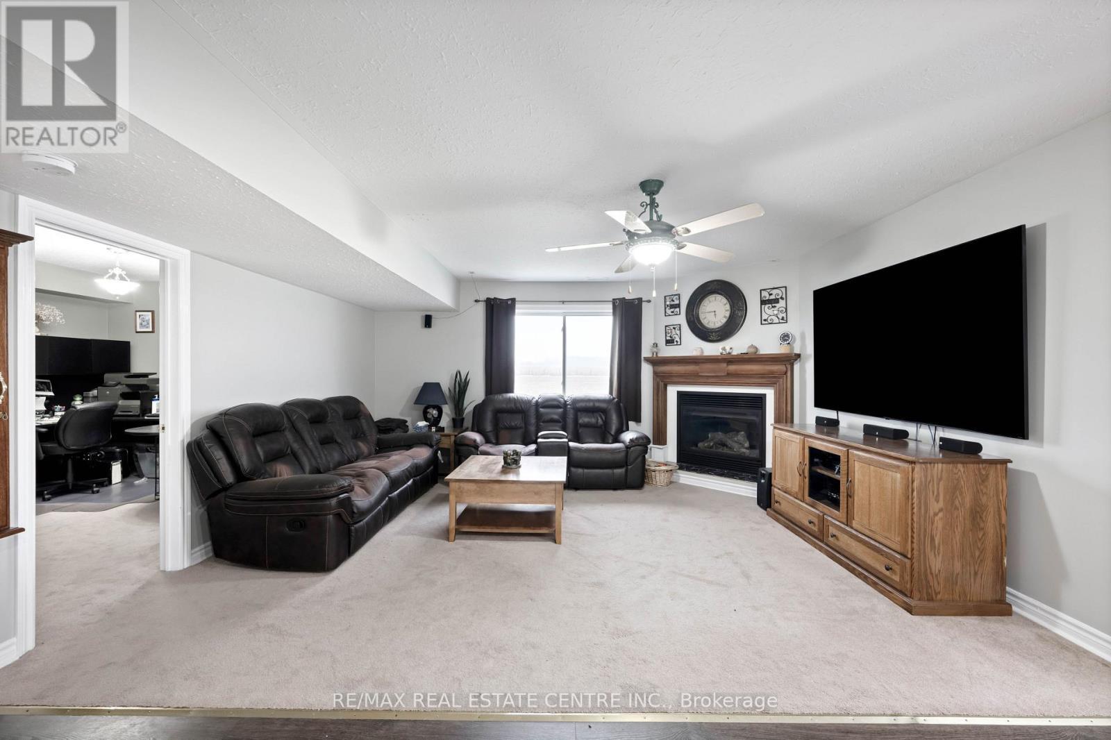 395115 County Road 12 Road, Amaranth, ON - Indoor Photo Showing Living Room With Fireplace