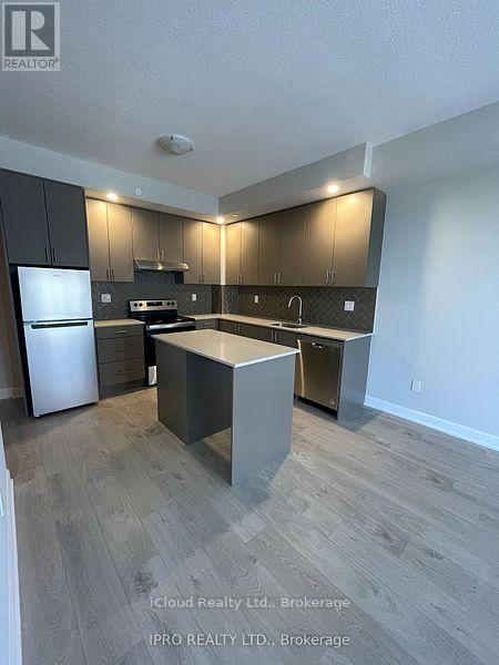 1706 - 3220 William Coltson Ave. Avenue, Oakville, ON - Indoor Photo Showing Kitchen With Stainless Steel Kitchen