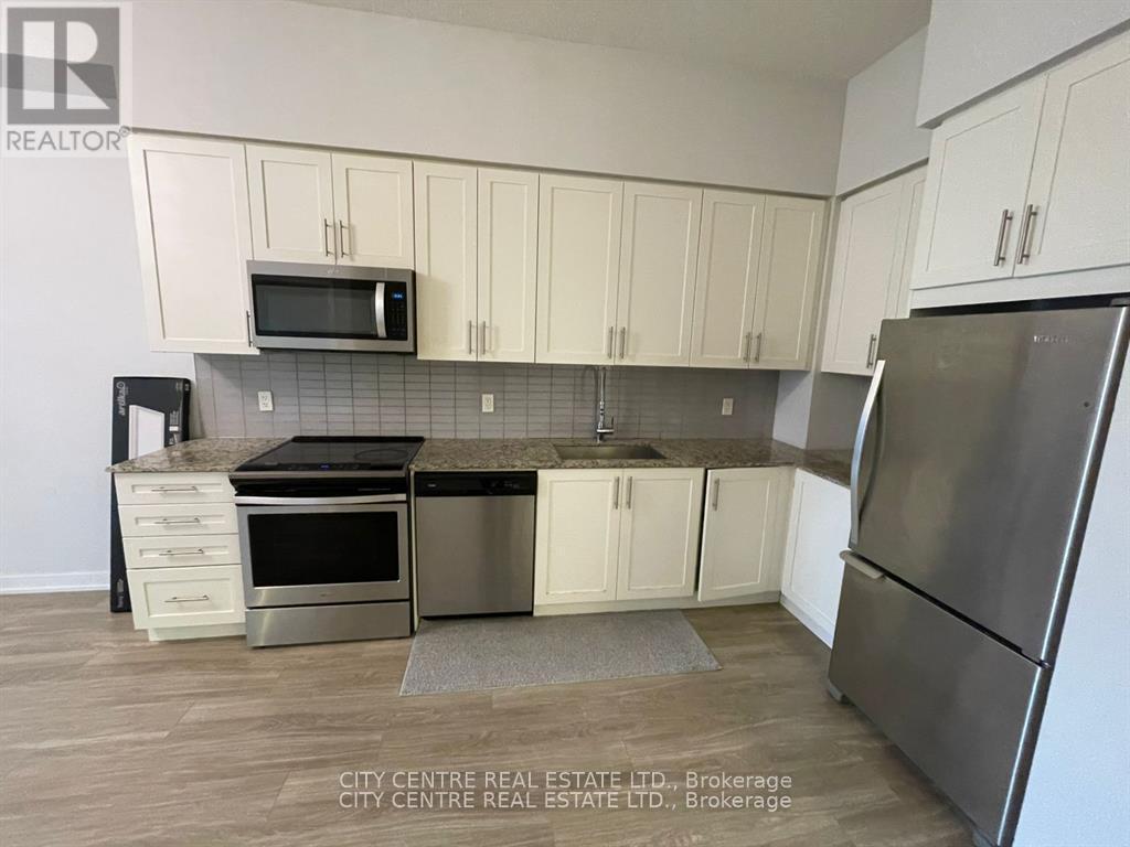 609 - 4085 Parkside Village Drive, Mississauga, ON - Indoor Photo Showing Kitchen With Stainless Steel Kitchen