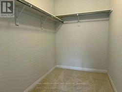 Primary Bed, 2 full walkin closets -