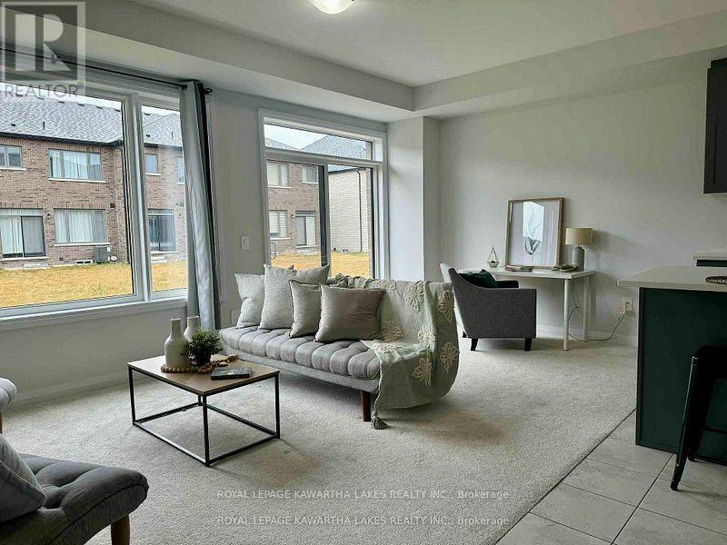 Patio door to back yard - 19 Keenan Street, Kawartha Lakes (Lindsay), ON - Indoor Photo Showing Living Room