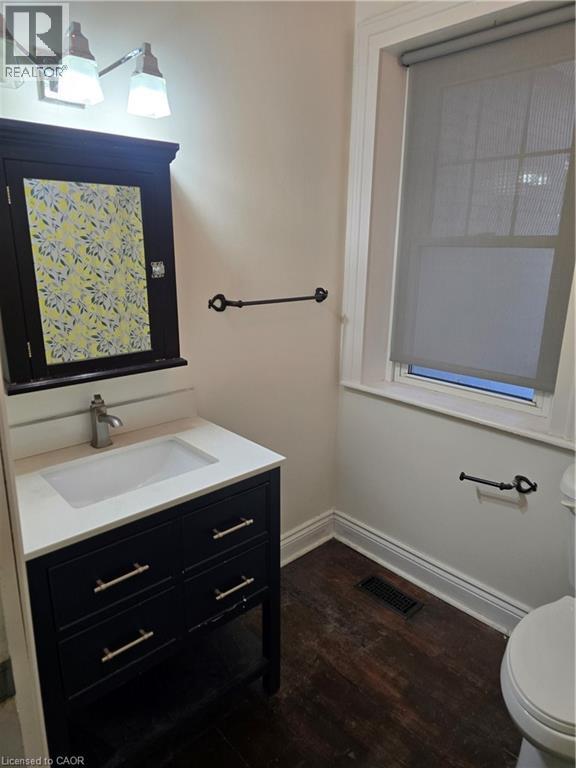 Bathroom featuring vanity and dark wood-style floors - 10 Centre Street, Elmira, ON - Indoor Photo Showing Bathroom