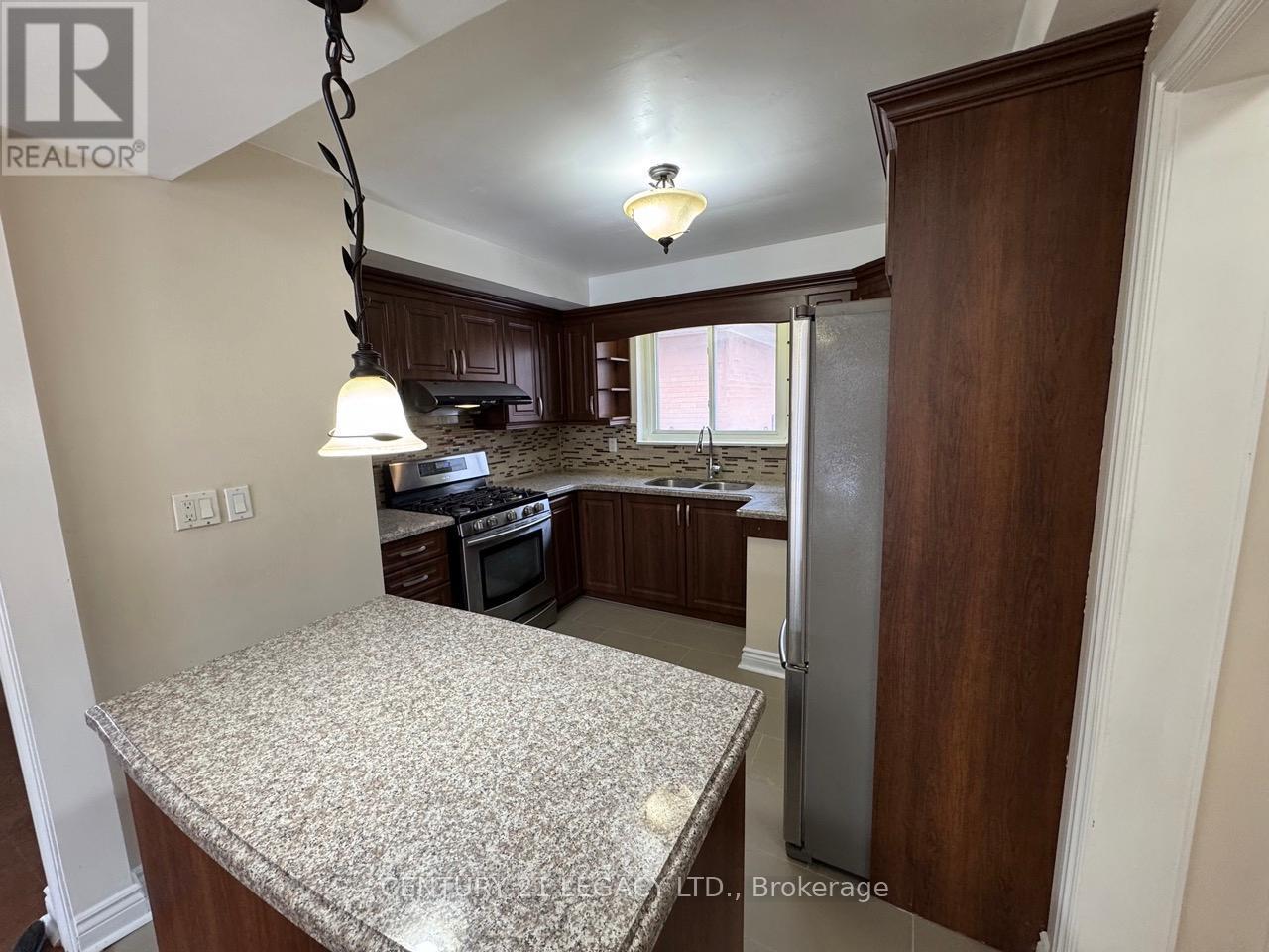 15 Vange Crescent, Toronto, ON - Indoor Photo Showing Kitchen With Double Sink