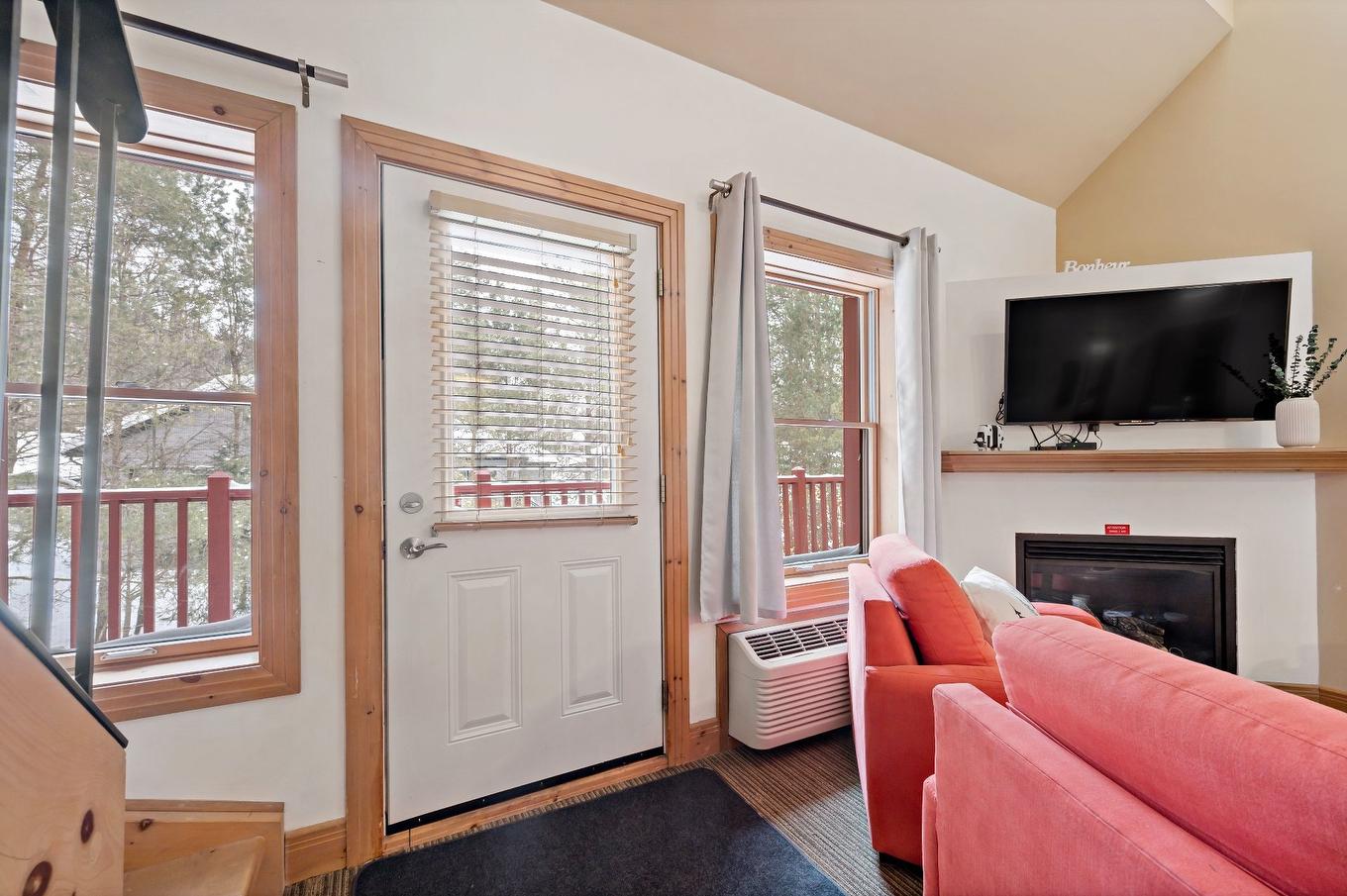 Living room - 864 Rue Coupal, Mont-Tremblant, QC - Indoor With Fireplace